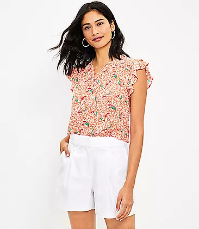 Fitted floral blouse and white linen shorts